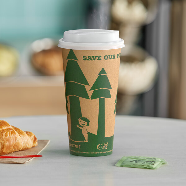 A paper EcoChoice Kraft hot cup with a lid on a table with a croissant.