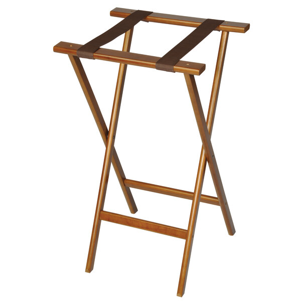 A CSL dark walnut wooden tray stand with brown straps on a table.