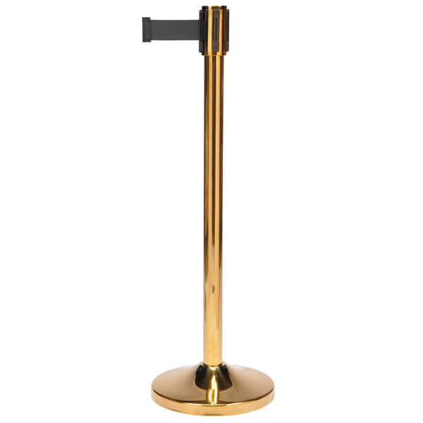 A gold stanchion pole with a black base.