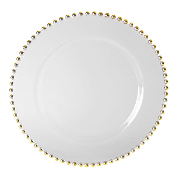 A white plate with gold beaded trim.