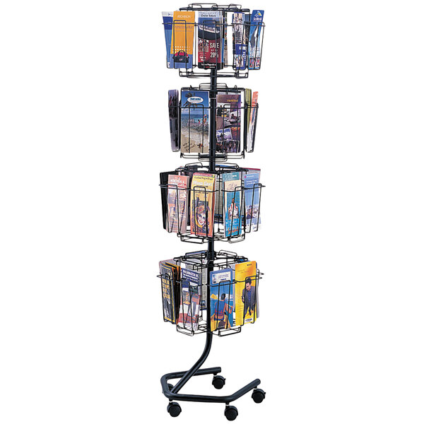 A Safco charcoal metal wire literature display rack with 32 compartments holding various items.