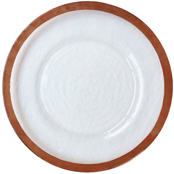 A close-up of a white Bon Chef charger plate with a rose gold rim.