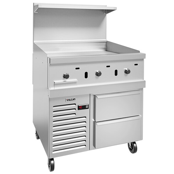 A white Vulcan commercial gas range with drawers and a griddle.