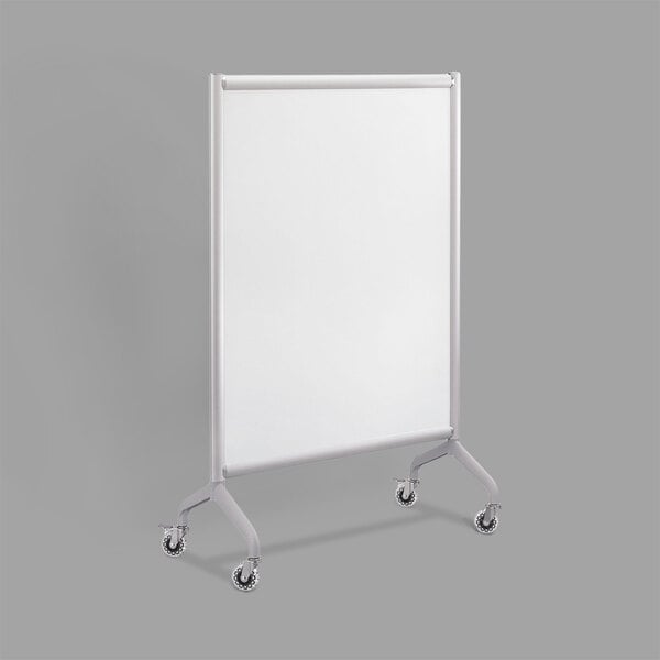 A white Safco Rumba whiteboard with wheels.