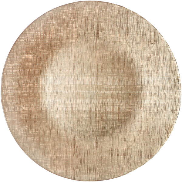 A close up of a Bon Chef champagne textured glass charger plate with a thin light brown pattern.