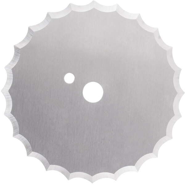 A circular metal blade with a hole in the center.