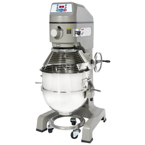 A Globe SP60 floor mixer with a large round white bowl on a metal stand.