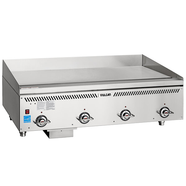 A large stainless steel Vulcan gas griddle on a counter.