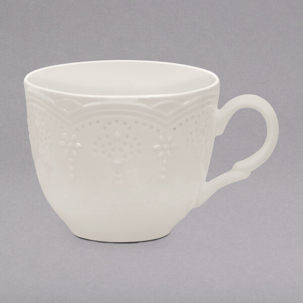 A white Valentina tea cup with a handle.