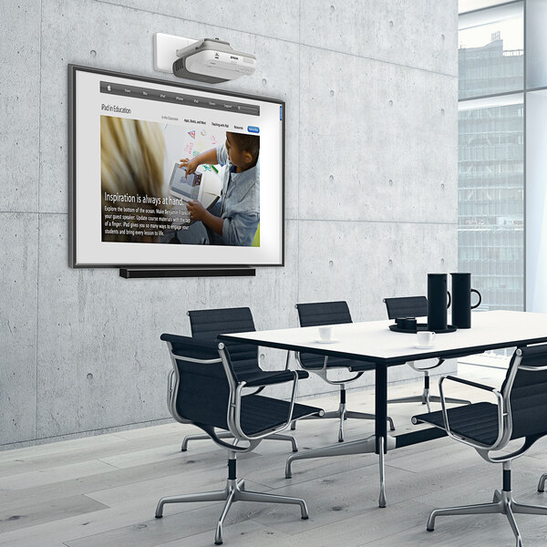 A white conference room with a MasterVision white interactive magnetic porcelain dry erase board with a black frame on the wall.