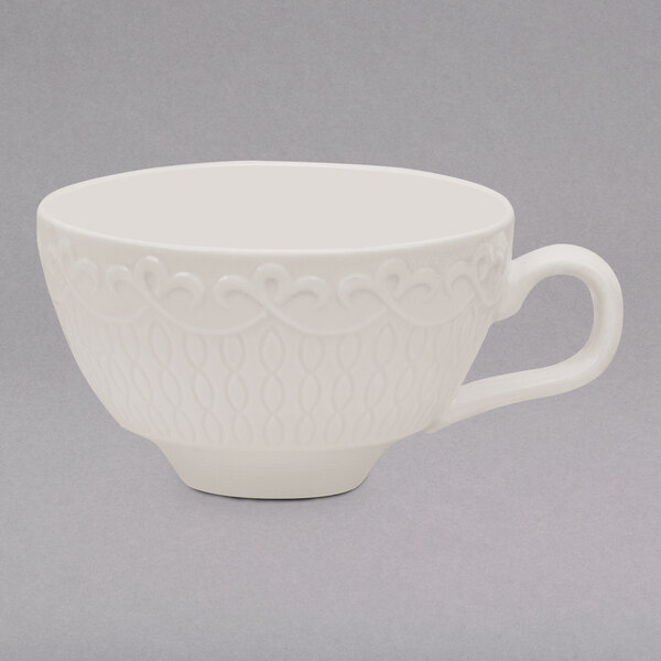 A 10 Strawberry Street white New Bone China tea cup with a decorative design on it.