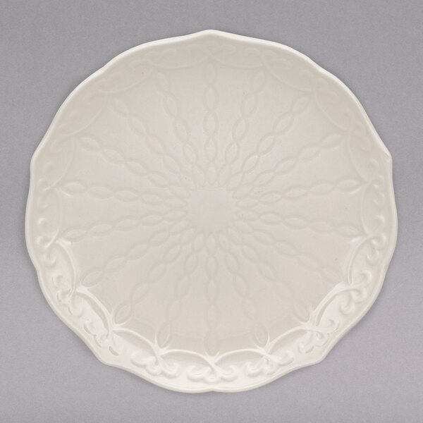 A white 10 Strawberry Street new bone china bread and butter plate with a circular design.