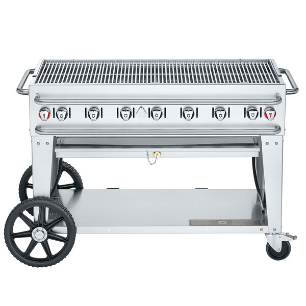 A Crown Verity stainless steel outdoor grill on a cart with wheels.