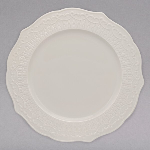 A white 10 Strawberry Street Ever bone china plate with a pattern on it.