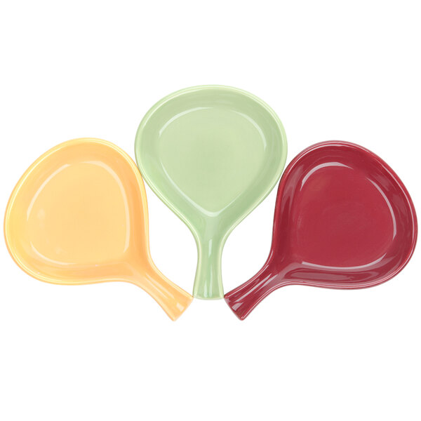 Three Tuxton fry pan servers in red, yellow, and green.