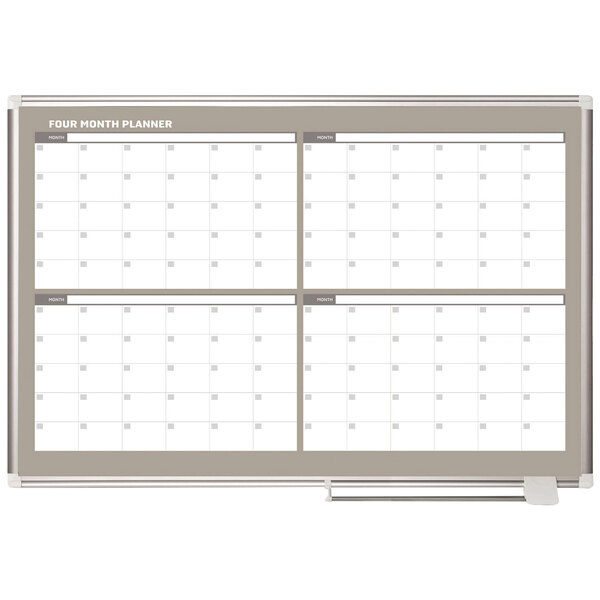 A white MasterVision dry erase board calendar with a silver frame.