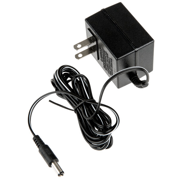 A black Taylor power adapter with a cord and a plug.