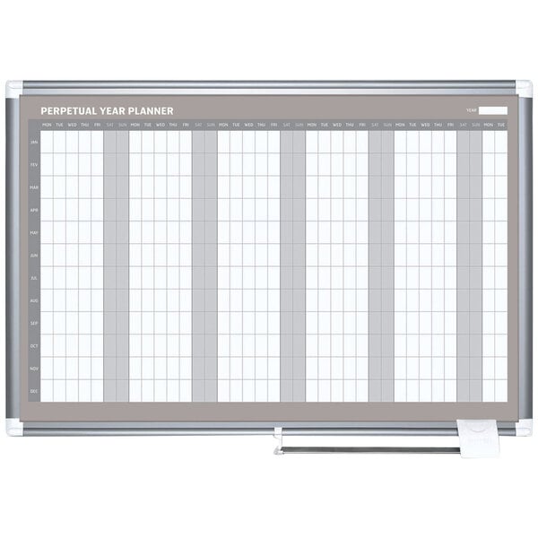 A white MasterVision dry erase board with a grid calendar.