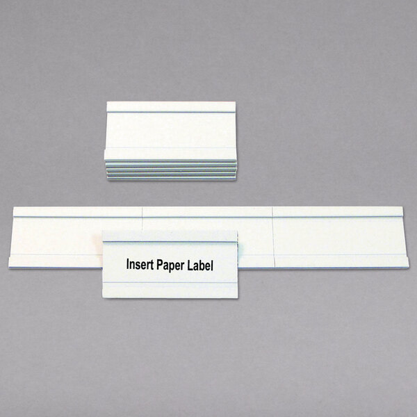 A stack of white rectangular magnetic card holders.
