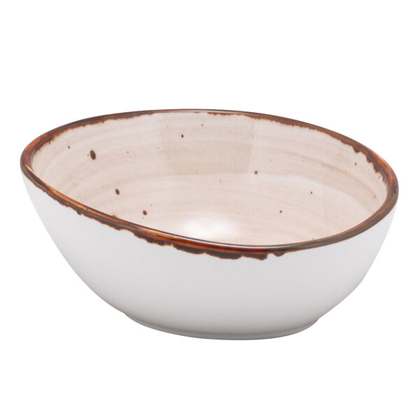A white bowl with brown specks.