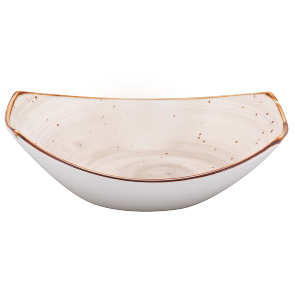 A white bowl with brown speckles on the rim.