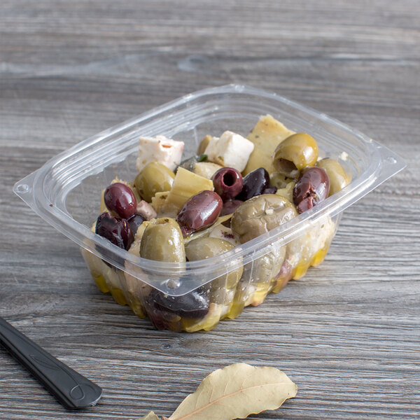 A Eco-Products rectangular plastic deli container filled with olives and cheese.