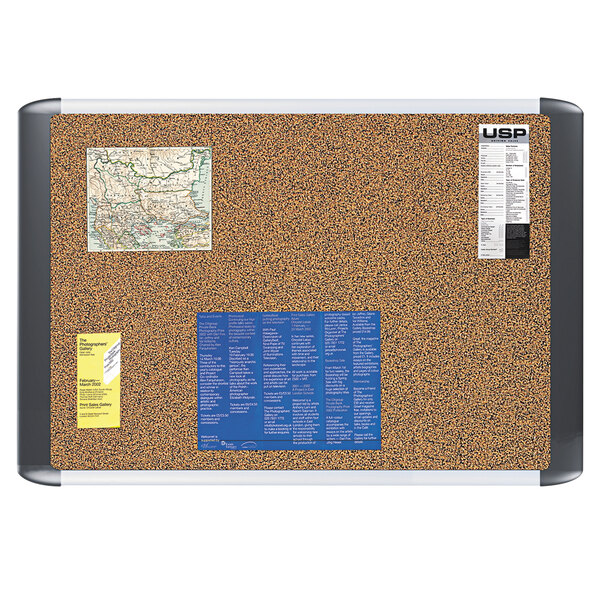 A MasterVision cork board with a map and stickers on it.