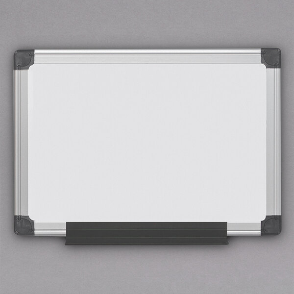 A MasterVision white board with a black frame and black corners.