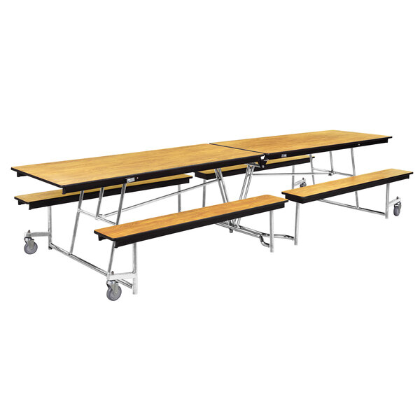 A National Public Seating rectangular plywood cafeteria table with attached benches on wheels.