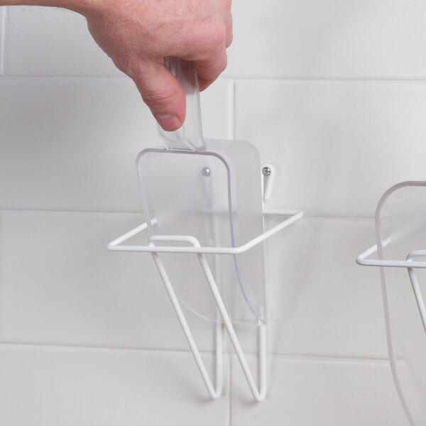 A hand holding a Choice clear plastic utility scoop.