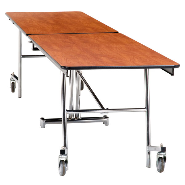 A National Public Seating rectangular cafeteria table with wheels on it.