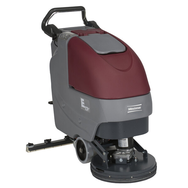 A red and grey Minuteman E17 walk behind floor scrubber with wheels.