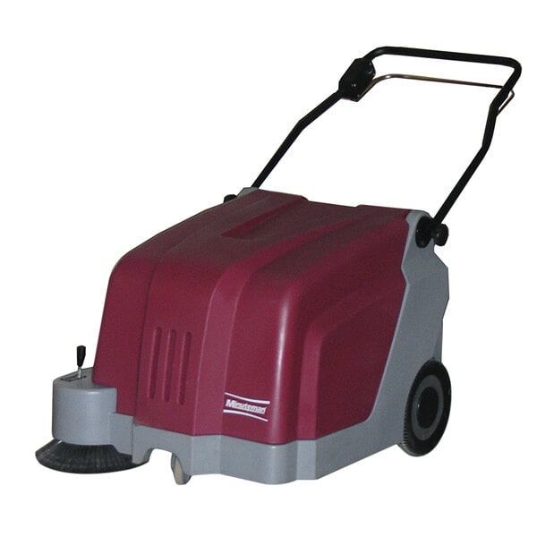 A red and gray Minuteman walk behind carpet sweeper with wheels.