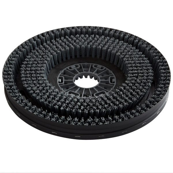 A circular black Minuteman disc brush with black bristles.