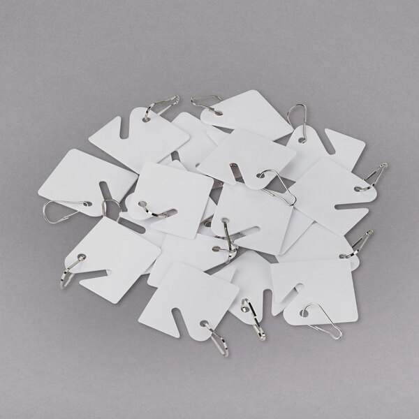 A group of white SecurIT replacement key tags with slotted holes.