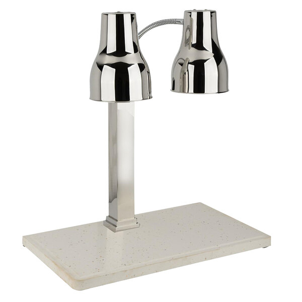 A Bon Chef carving station with two silver heat lamps on a white marble table.