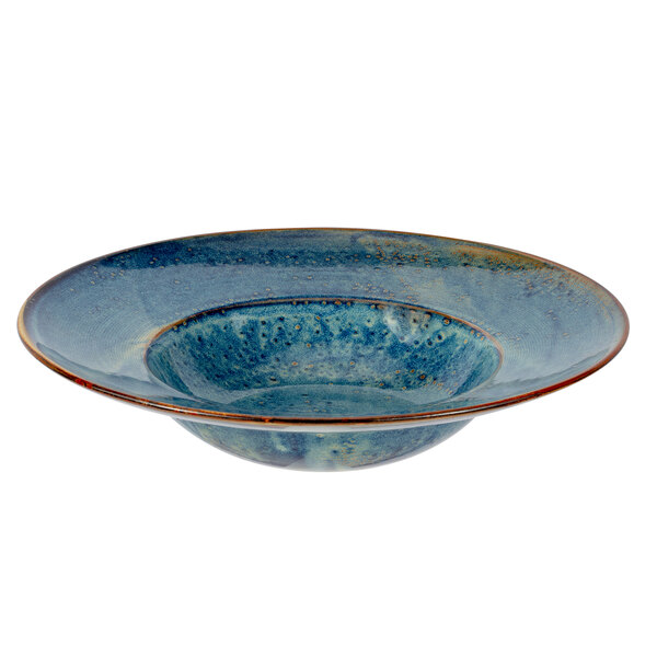 A white porcelain bowl with a blue interior and brown rim.