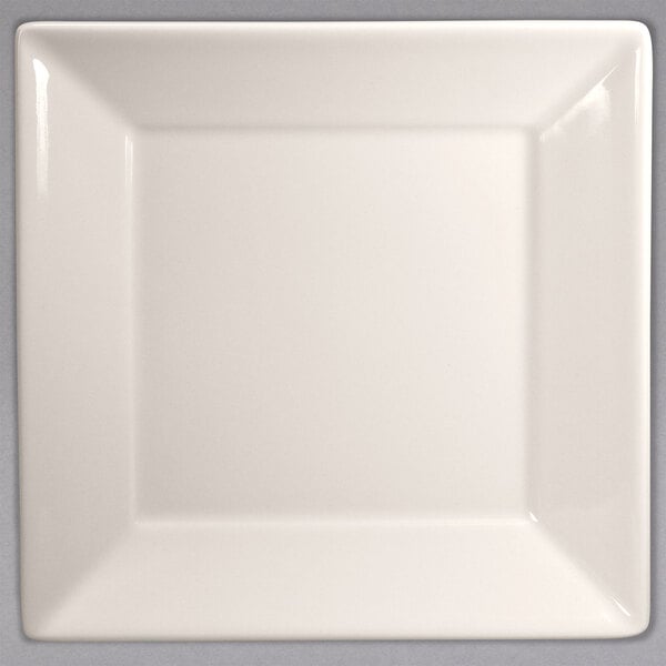 A white square Homer Laughlin china plate with a small square cut out.