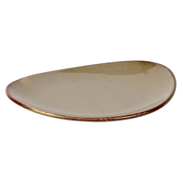 A white porcelain salad plate with a brown rim.