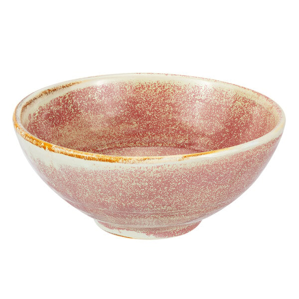 A white porcelain Bon Chef bowl with a speckled pink and brown surface.