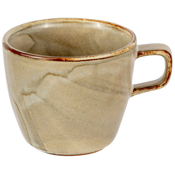A white porcelain tea cup with a handle.