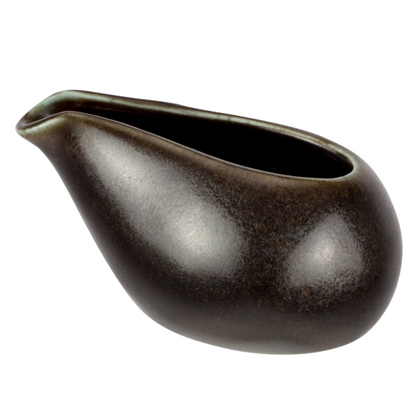 A black ceramic Bon Chef creamer with a brown handle.