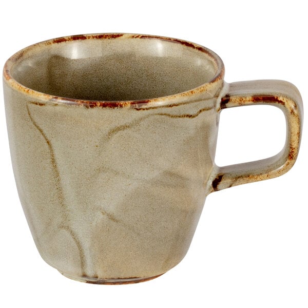 A white porcelain espresso cup with a brown handle and rim.