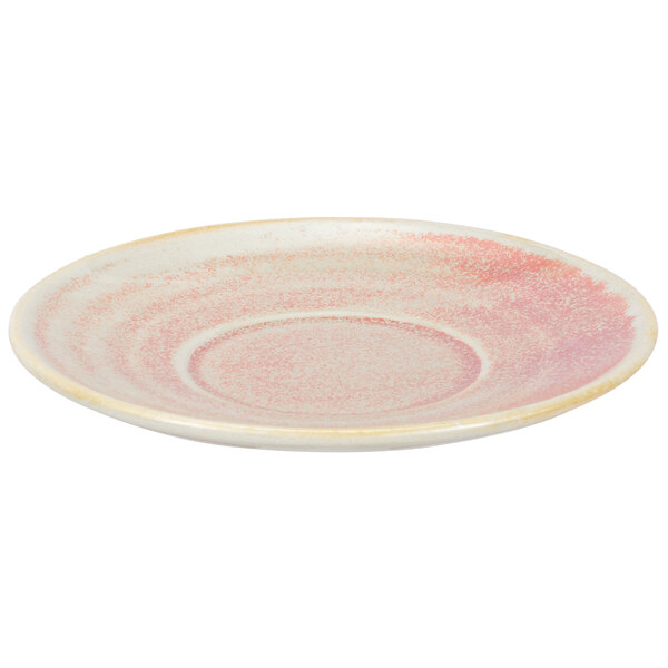 A close up of a white and pink Bon Chef Tavola Blush porcelain saucer with a rim.