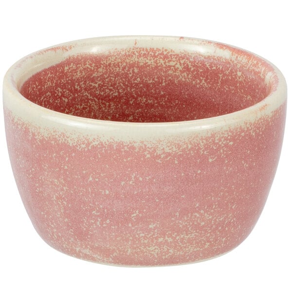 A close up of a pink and white Bon Chef porcelain ramekin.
