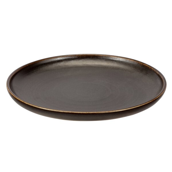 A black porcelain dinner plate with an upstanding brown rim.