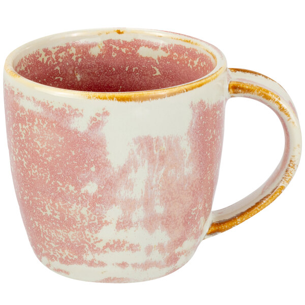 A close up of a Bon Chef Tavola Blush pink and white porcelain mug with gold accents.