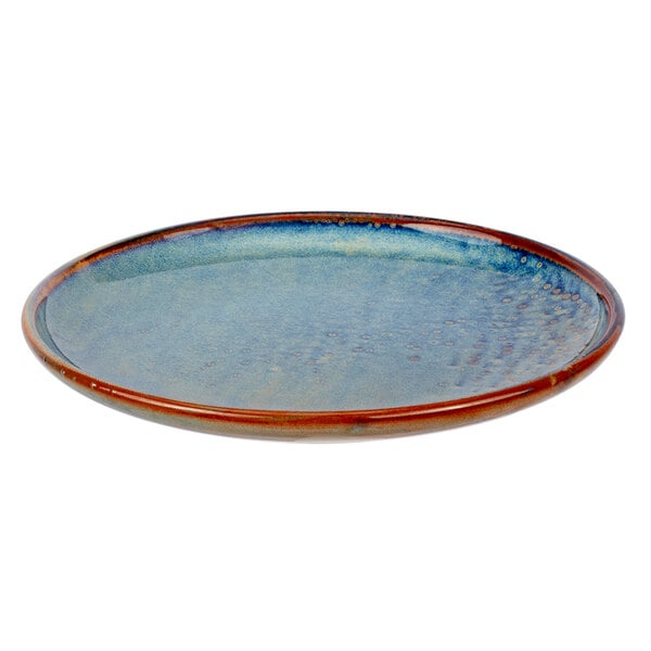 A close-up of a blue and brown Bon Chef Tavola Marea porcelain salad plate with a rim.