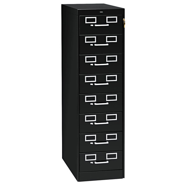 A black Tennsco multimedia cabinet with eight drawers and silver handles.