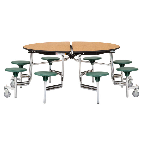 A National Public Seating round cafeteria table with green seats on metal legs.